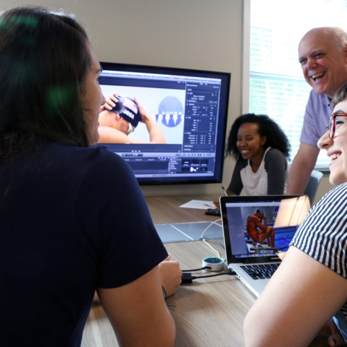 Students Ella Fox, Hiwot Hailu, and Abby Laine Faber prepare for Rio de Janeiro with Bob Page, advisor to student media at Queens University of Charlotte.