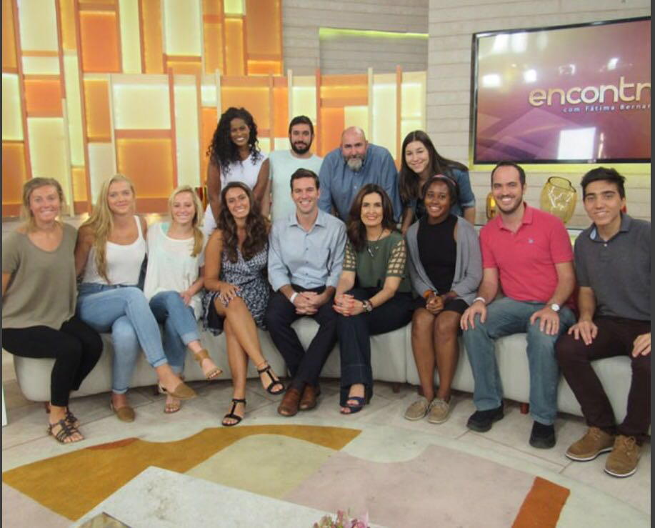 Ashley Osiecki, Kelsey McCormick, and Alex Bruder of Queens University of Charlotte (from left). Fatima is in the green blouse in front. In the red shirt is Daniel Amgarten of Campus Brasil. In the gray shirt at far right is Mackenzie Presbyterian University student Luis Ottoni, field producer and translator for Queens in Rio.