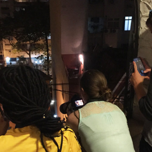 American university students watching for signs of a protest in the Copacabana neighborhood, Pura Vida Hostel, Aug. 9, 2016